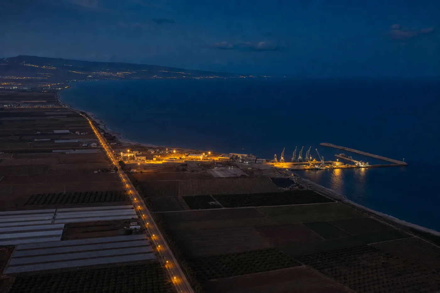 An open industrial site seen from a rise
